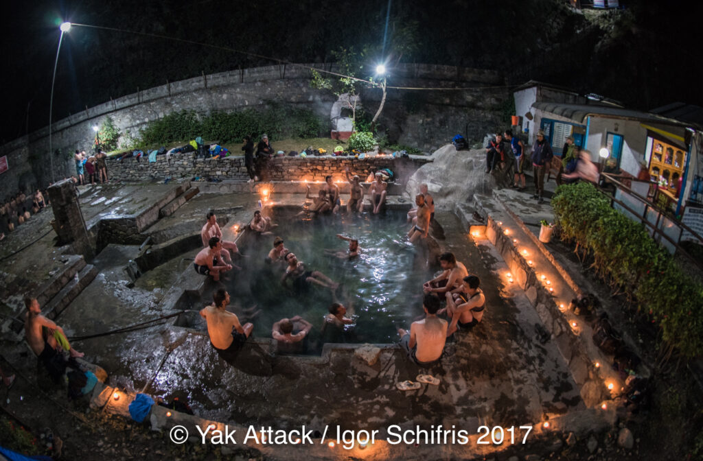 Showing riders relaxing in the hotsprings at Tatopani, Nepal