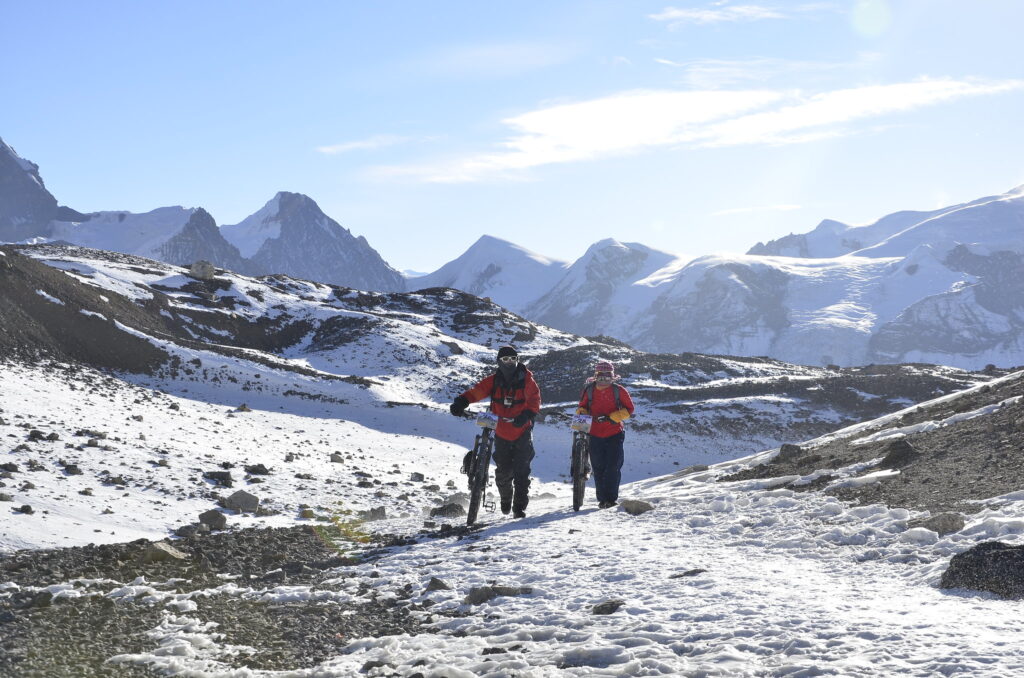 Pushing bikes to the summit of Thorong La