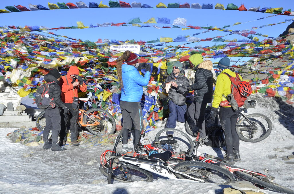 Prayer flags on the summit of Thorong La