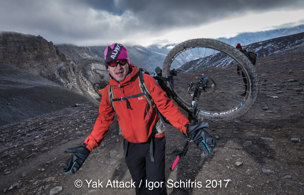 Neil Cottam carrying his bike