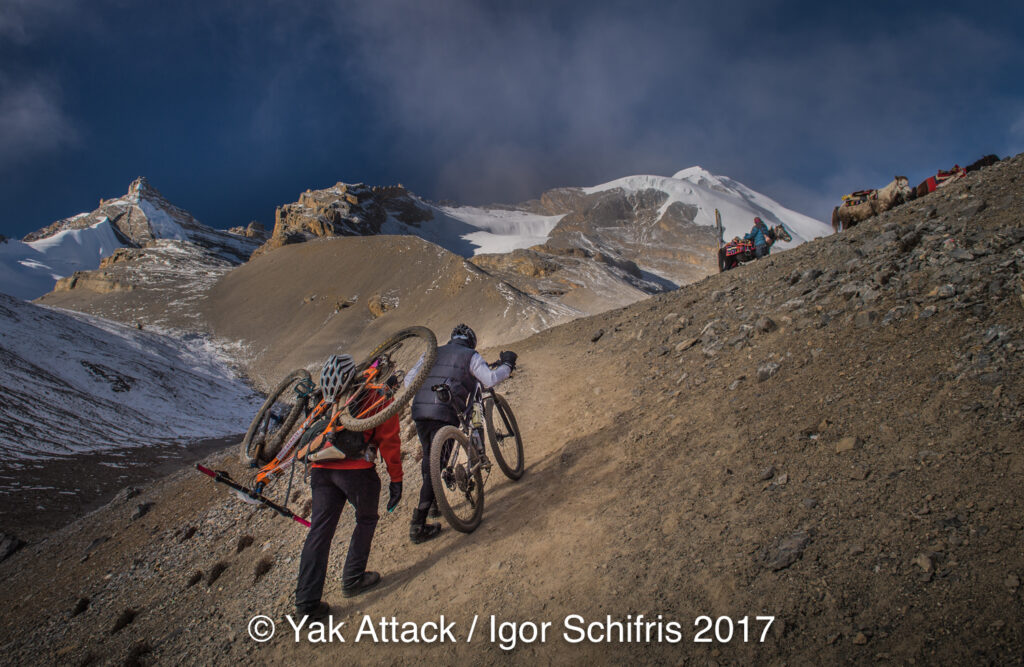 Pushing and carrying bikes up Thorong La
