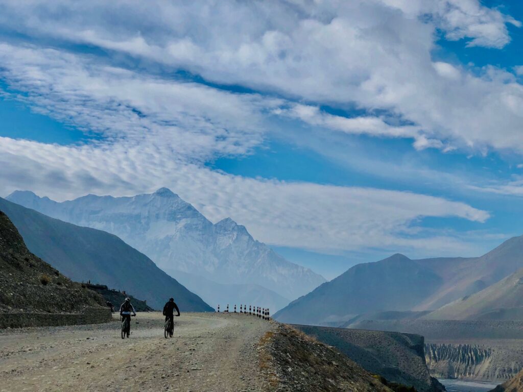 2 cyclists riding the highway in Upper Mustang